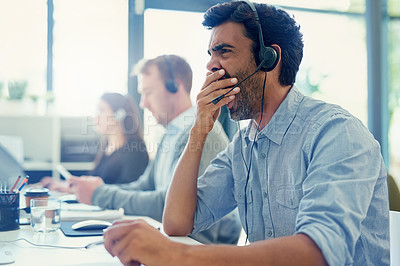 Buy stock photo Yawn, tired and telemarketing with man, call center and overworked with crm, help desk and office. Business, burnout or employee with headphones, agent and fatigue with consultant or customer service