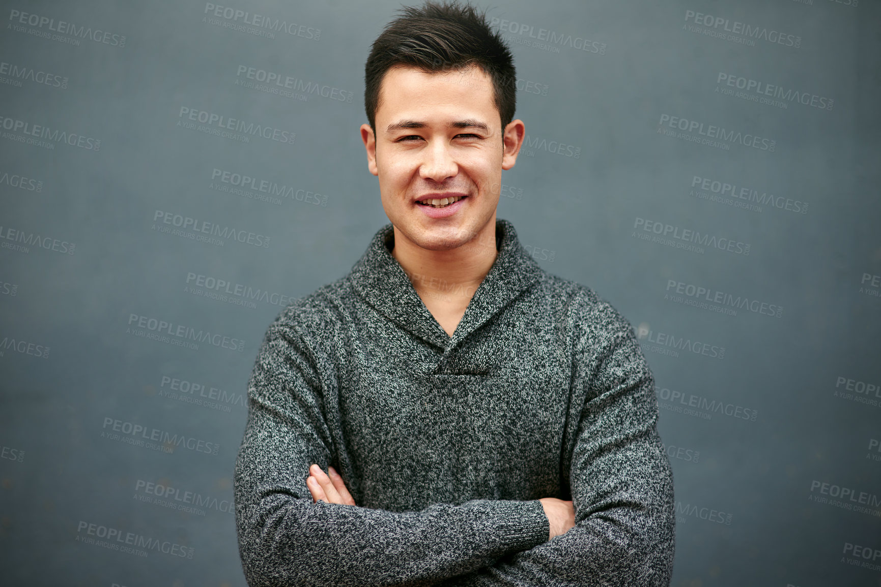 Buy stock photo Man, portrait smile and arms crossed for fashion with style inspiration, organic fabric and mockup in studio. Guy, happy and pride for ethical brand, clothes and promotion space by gray background