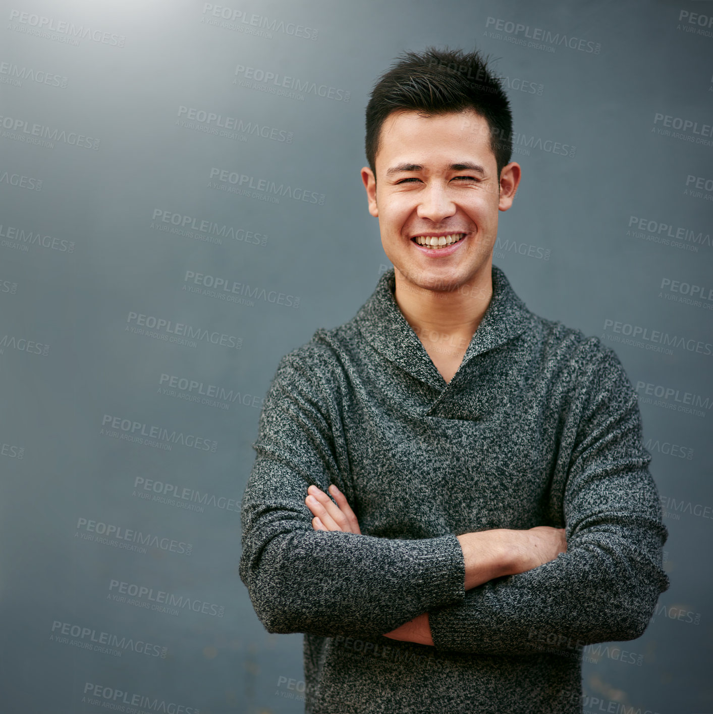 Buy stock photo Studio portrait of a handsome young man posing against a grey background