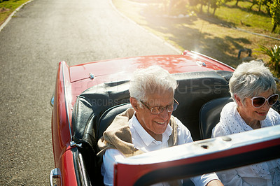 Buy stock photo Old couple, driving and convertible car or countryside road trip in vineyard for retirement, marriage or adventure. Man, woman and transportation in Napa valley or exploring, nature or journey