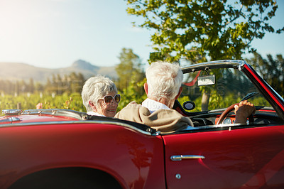 Buy stock photo Old couple, road trip and convertible car countryside driving in vineyard or retirement travel, marriage or adventure. Man, woman and transportation in Napa valley or exploring, nature or journey