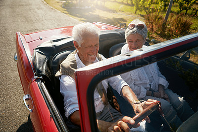 Buy stock photo Senior, couple and road or driving convertible for retirement date or holiday adventure, vineyard or transportation. Man, woman and old people in luxury car in California for morning, travel or relax
