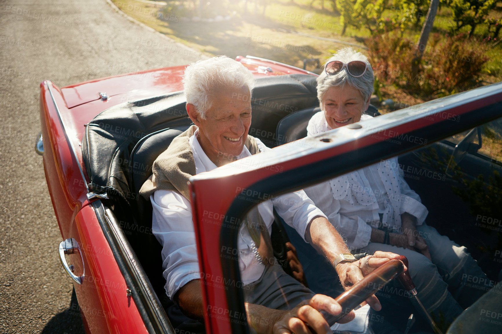 Buy stock photo Senior, couple and road or driving convertible for retirement date or holiday adventure, vineyard or transportation. Man, woman and old people in luxury car in California for morning, travel or relax