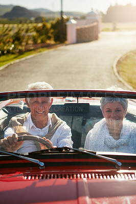 Buy stock photo Old couple, driving and convertible car on adventure road trip to explore California, retirement or transport. Man, woman and countryside travel in nature vineyard for weekend, vacation or vehicle