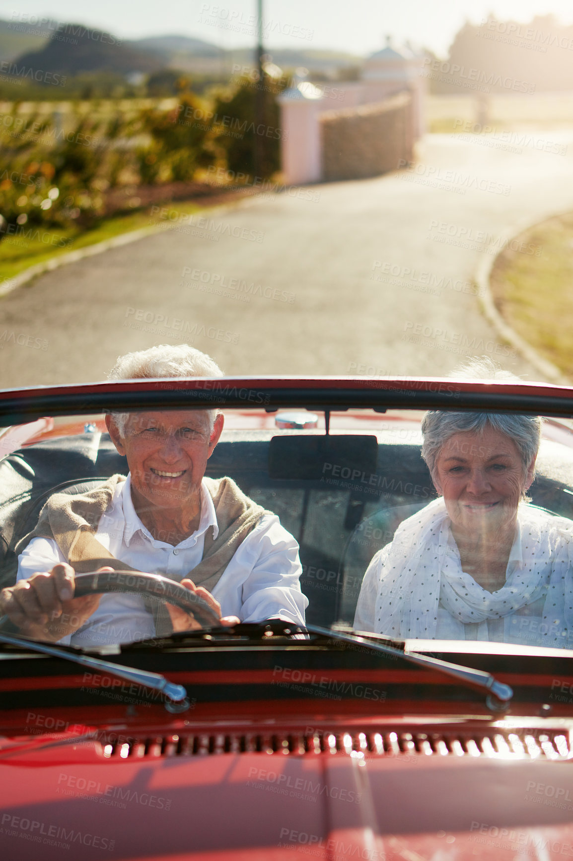 Buy stock photo Old couple, driving and convertible car on adventure road trip to explore California, retirement or transport. Man, woman and countryside travel in nature vineyard for weekend, vacation or vehicle