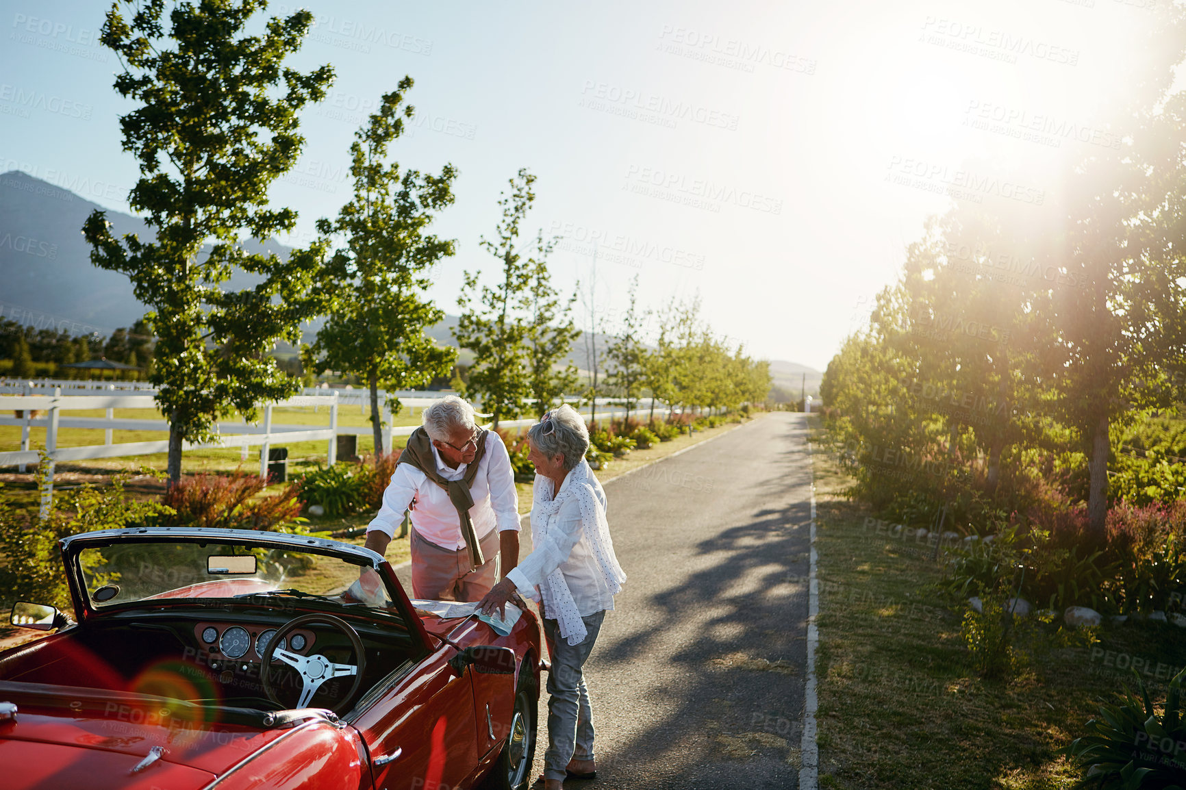 Buy stock photo Shot of a senior couple going on a road trip 