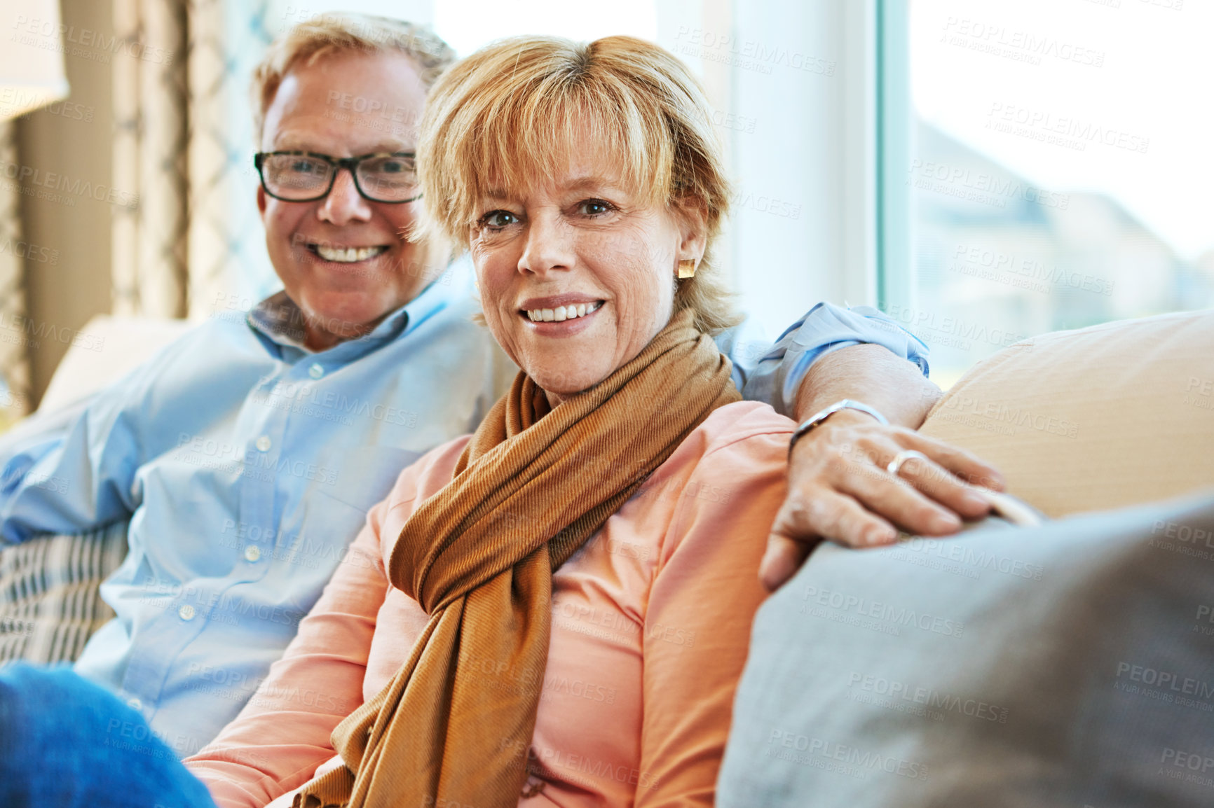 Buy stock photo Relax, smile and portrait of mature couple on sofa for bonding, healthy relationship and marriage. Retirement, home and senior man and woman on couch for love, commitment and happiness in living room