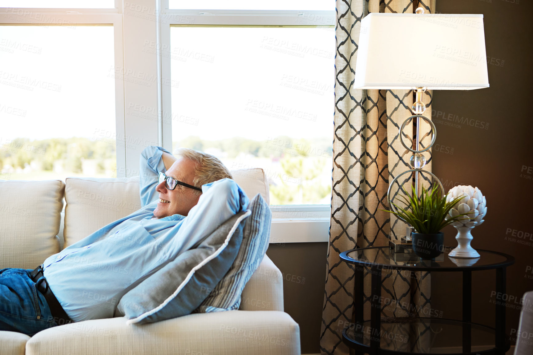 Buy stock photo Thinking, couch or happy mature man in house living room to relax with nostalgia or freedom on resting break. Glasses, remember or senior male person with smile, joy or memory in retirement on sofa