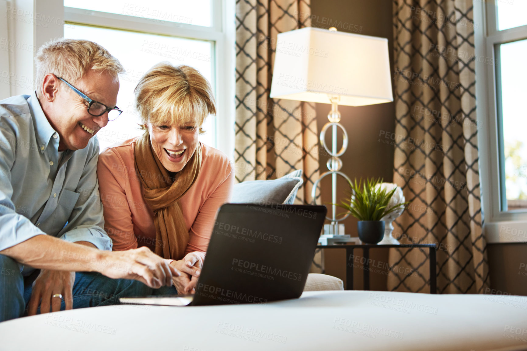 Buy stock photo Laptop, happiness or mature couple in home typing for savings, property investment or online shopping. Ecommerce, website or senior people planning for investing or research on pc on sofa together