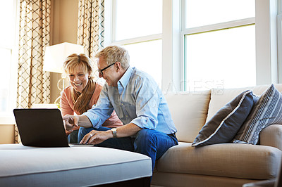 Buy stock photo Laptop, smile or mature couple in home typing for savings, property investment or online shopping together. Finance, website or happy senior people planning for investing or research on pc on sofa