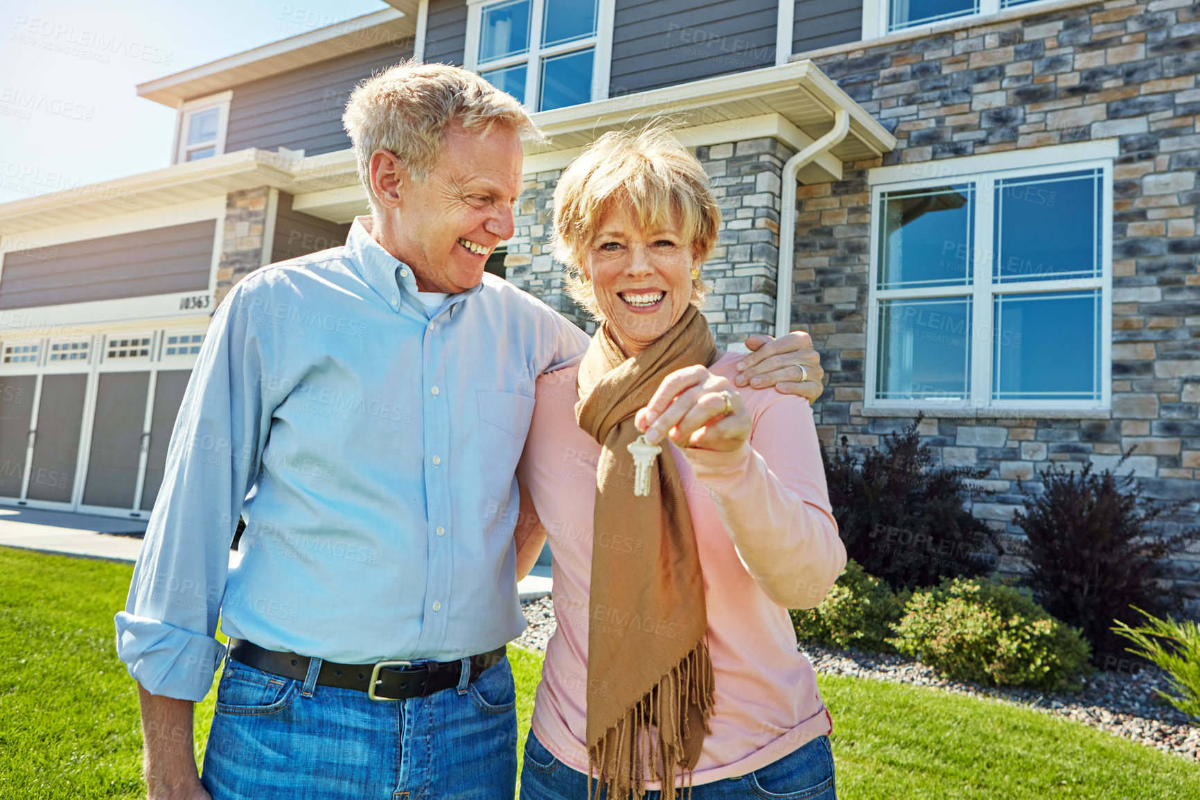 Buy stock photo Portrait of a happy senior couple posing outside their new home