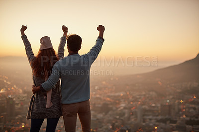 Buy stock photo Rearview shot of an affectionate  young couple admiring a city view at dawn