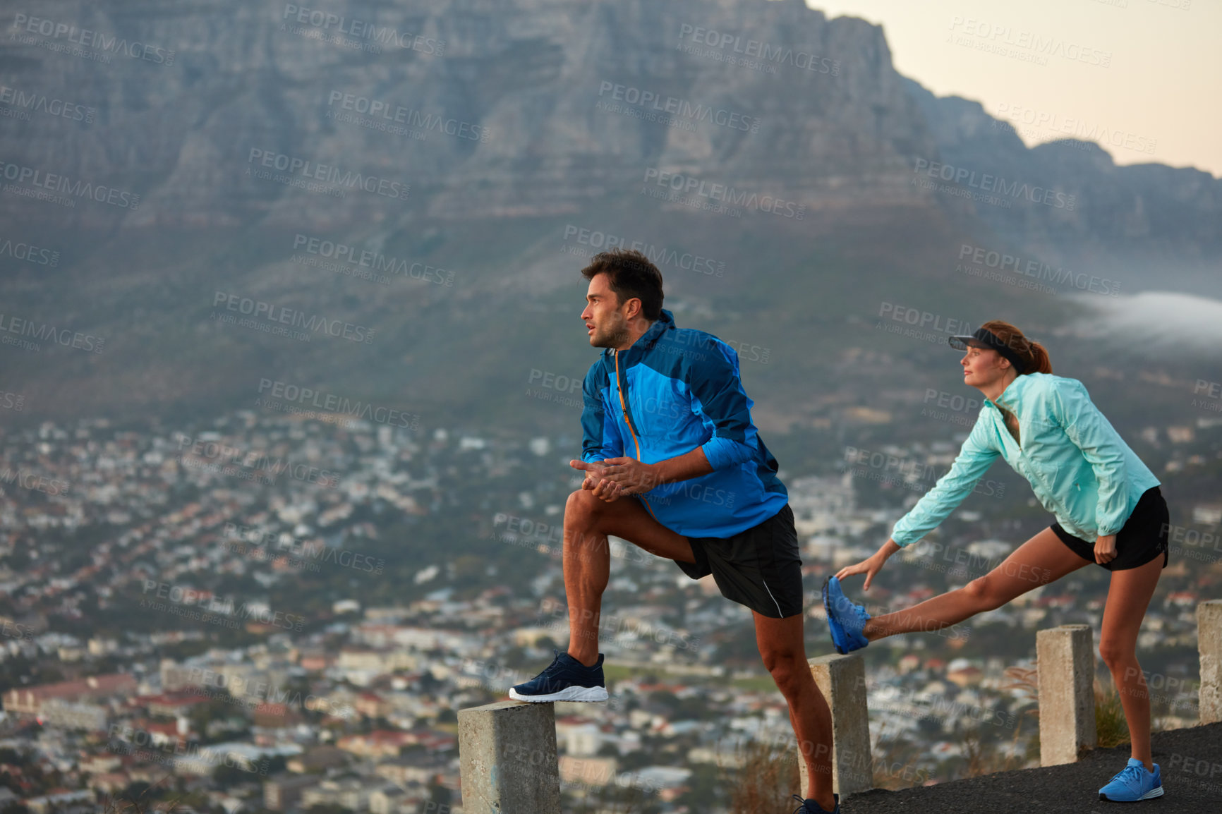 Buy stock photo Shot of an athletic young couple out for a run in the morning