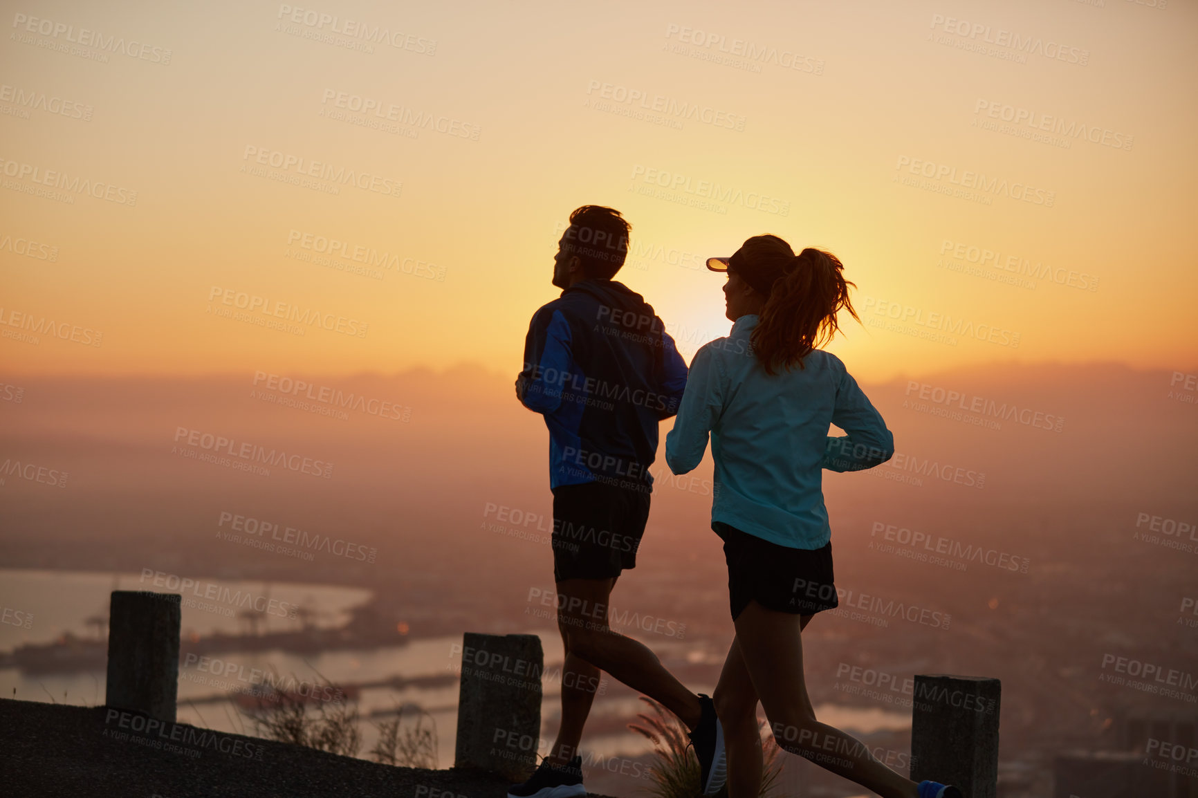 Buy stock photo Couple, running and sunrise exercise in outdoor, together and cardio challenge or marathon training. Athlete people, action and bonding on jog in nature, fitness and sports workout or practice