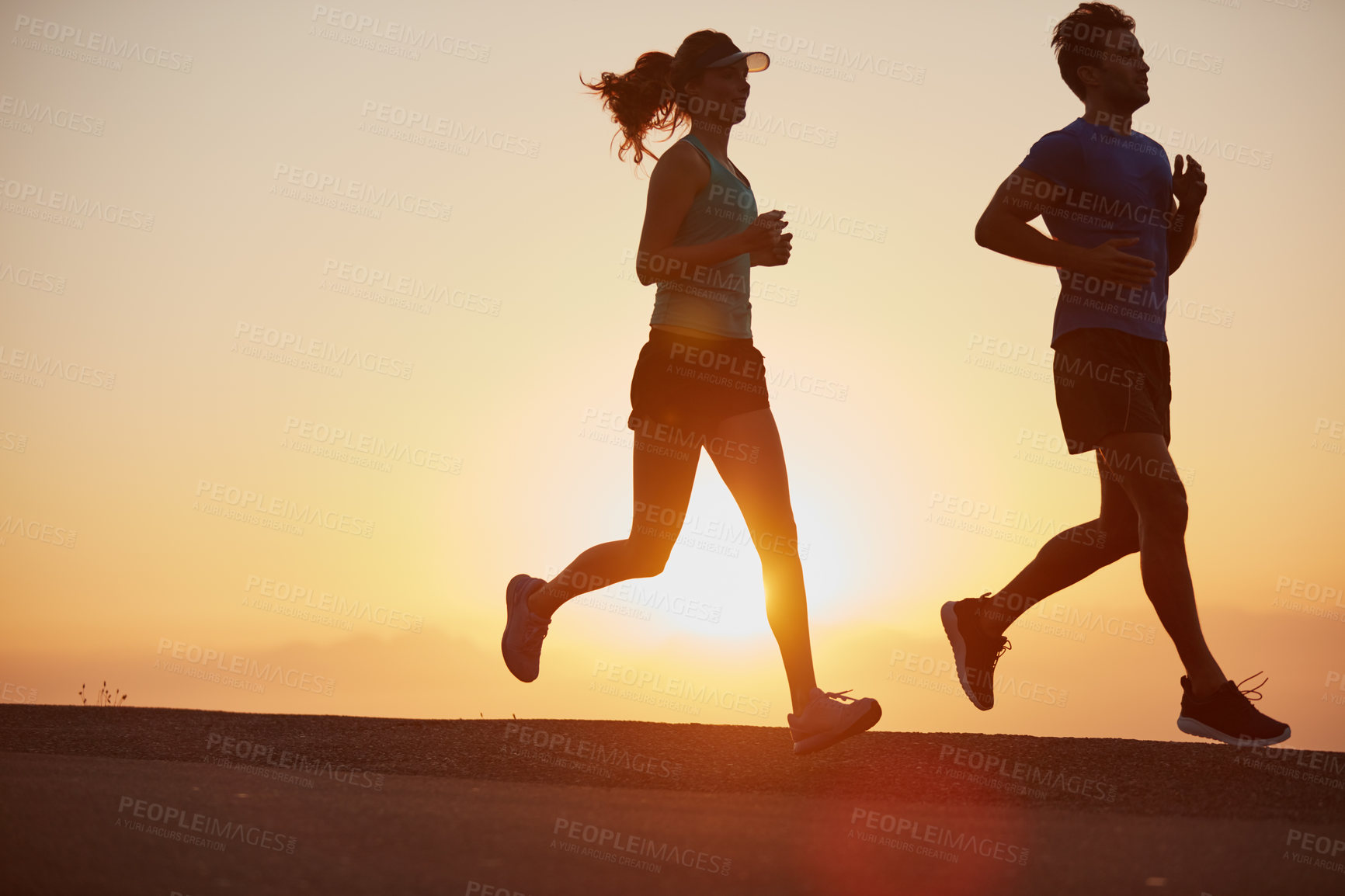 Buy stock photo Sunrise, couple and running outdoor with silhouette of training, exercise and fitness with cardio for health. Wellness, sport and athlete with runner partner in nature in the morning with sprint