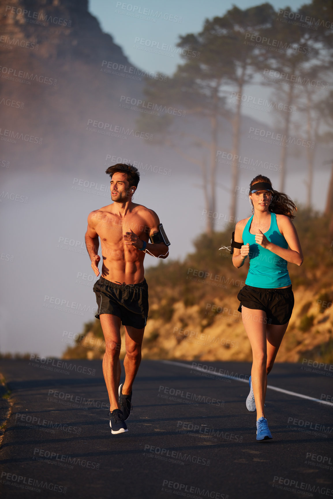 Buy stock photo Couple, running and exercise in outdoor street, coaching and cardio challenge or marathon training. People, action and bonding together on jog on mountain road, fitness and sports workout or practice