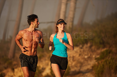 Buy stock photo Couple, nature and exercise in outdoor running, coaching and cardio challenge or marathon training. People, action and bonding together on morning jog in park, fitness and sports workout or practice