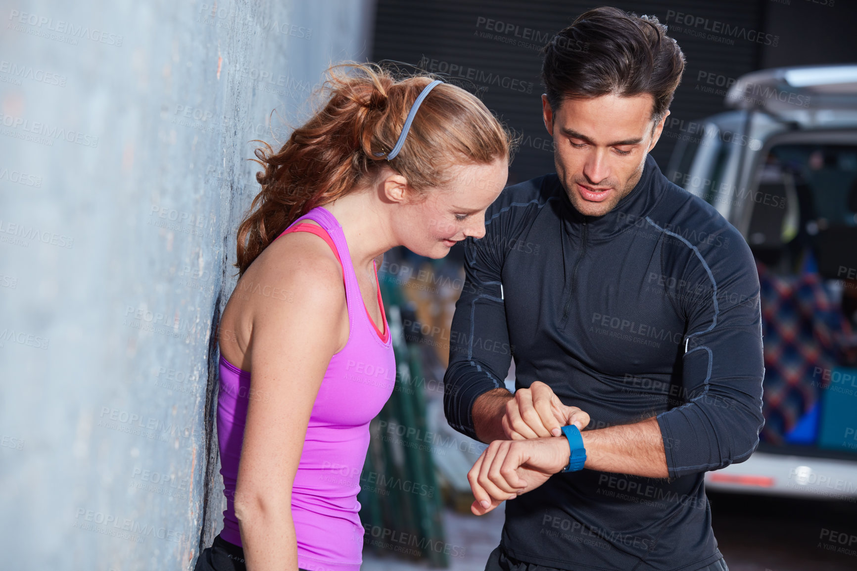 Buy stock photo Shot of two training partners taking a break together outside