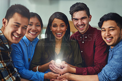 Buy stock photo Portrait of a team of designers holding a glowing ball in an office