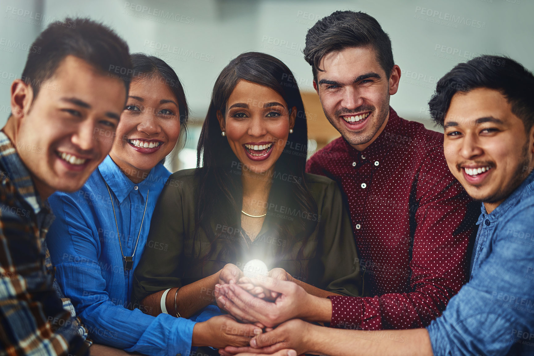 Buy stock photo Portrait of a team of designers holding a glowing ball in an office