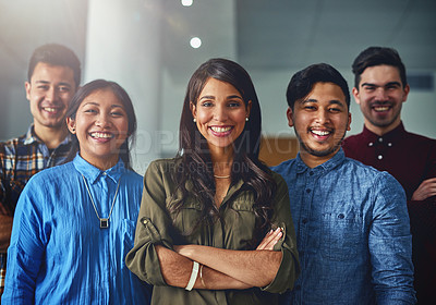 Buy stock photo Portrait of a team of confident young designers standing together in an office