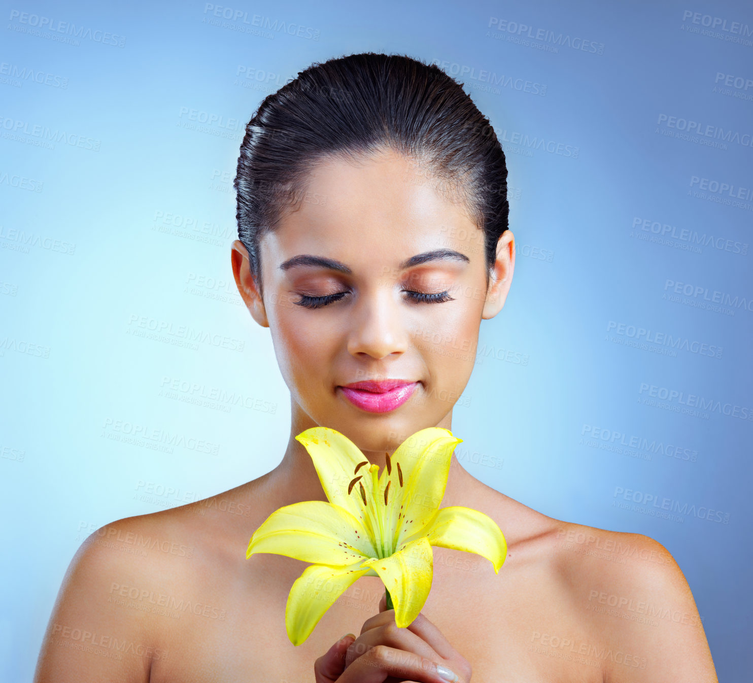 Buy stock photo Woman, makeup and eyes closed with flower in studio background for natural or organic products. Female person, smile and smell aroma with plant as ingredient or recipe for eco friendly beauty