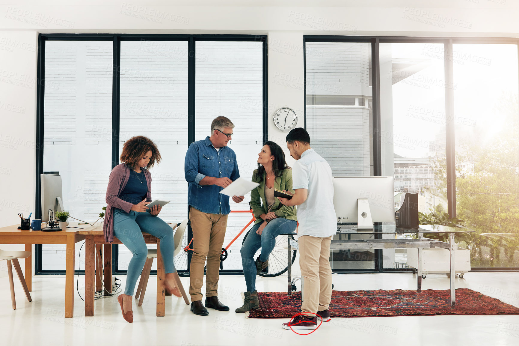 Buy stock photo Full length shot of four creative professionals talking in the office