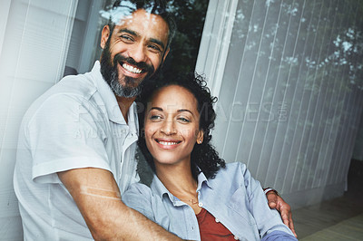 Buy stock photo Shot of a relaxed couple enjoying the day at home together