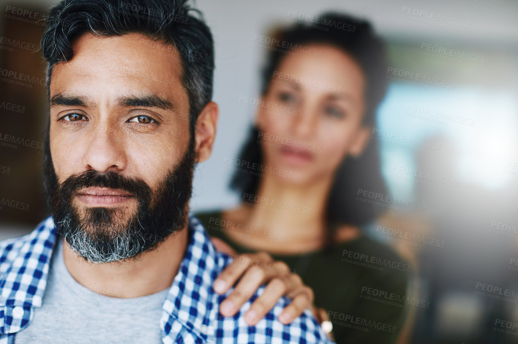 Buy stock photo Portrait of a distraught man being comforted by his wife at home