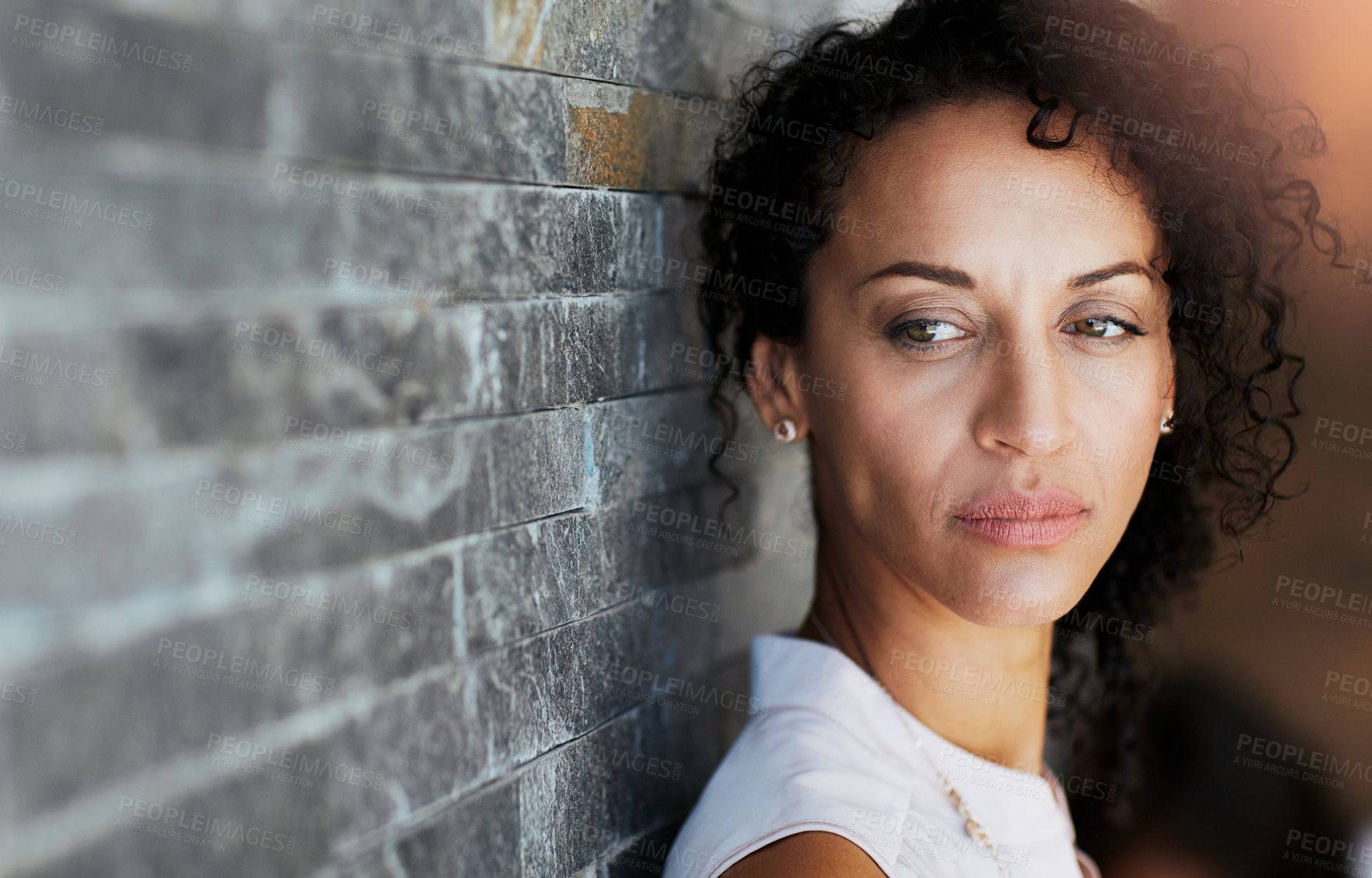 Buy stock photo Brick wall, serious and woman by space, thinking and thoughts of future plans outdoor. Face, anxiety and contemplation with ideas for assertive girl outside, planning and introspection by mockup