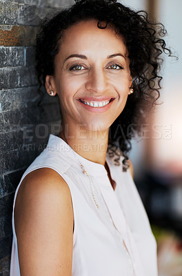 Buy stock photo Portrait of a happy woman posing against a brick wall at home