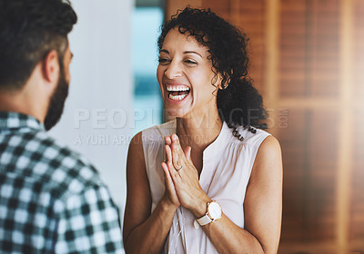 Buy stock photo Shot of a loving couple celebrating some good news together at home
