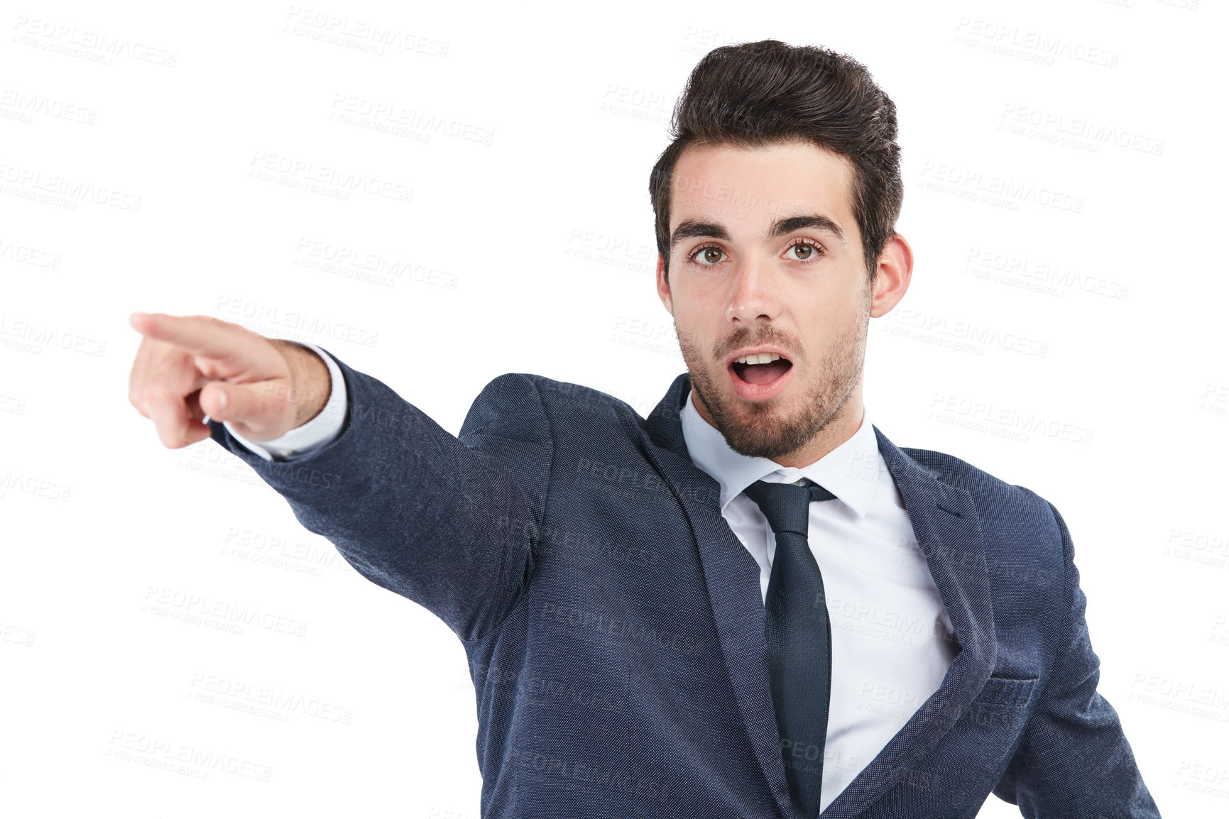 Buy stock photo Studio shot of a young businessman pointing towards something against a white background