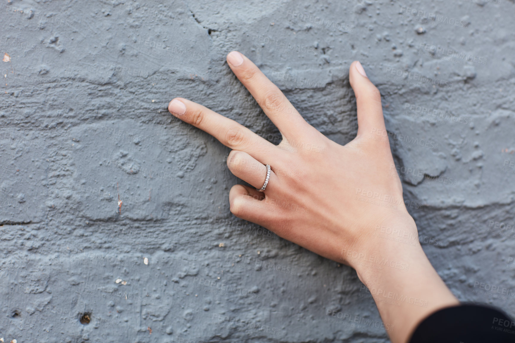 Buy stock photo Cropped shot of an engagement ring on an unrecognizable woman's hand