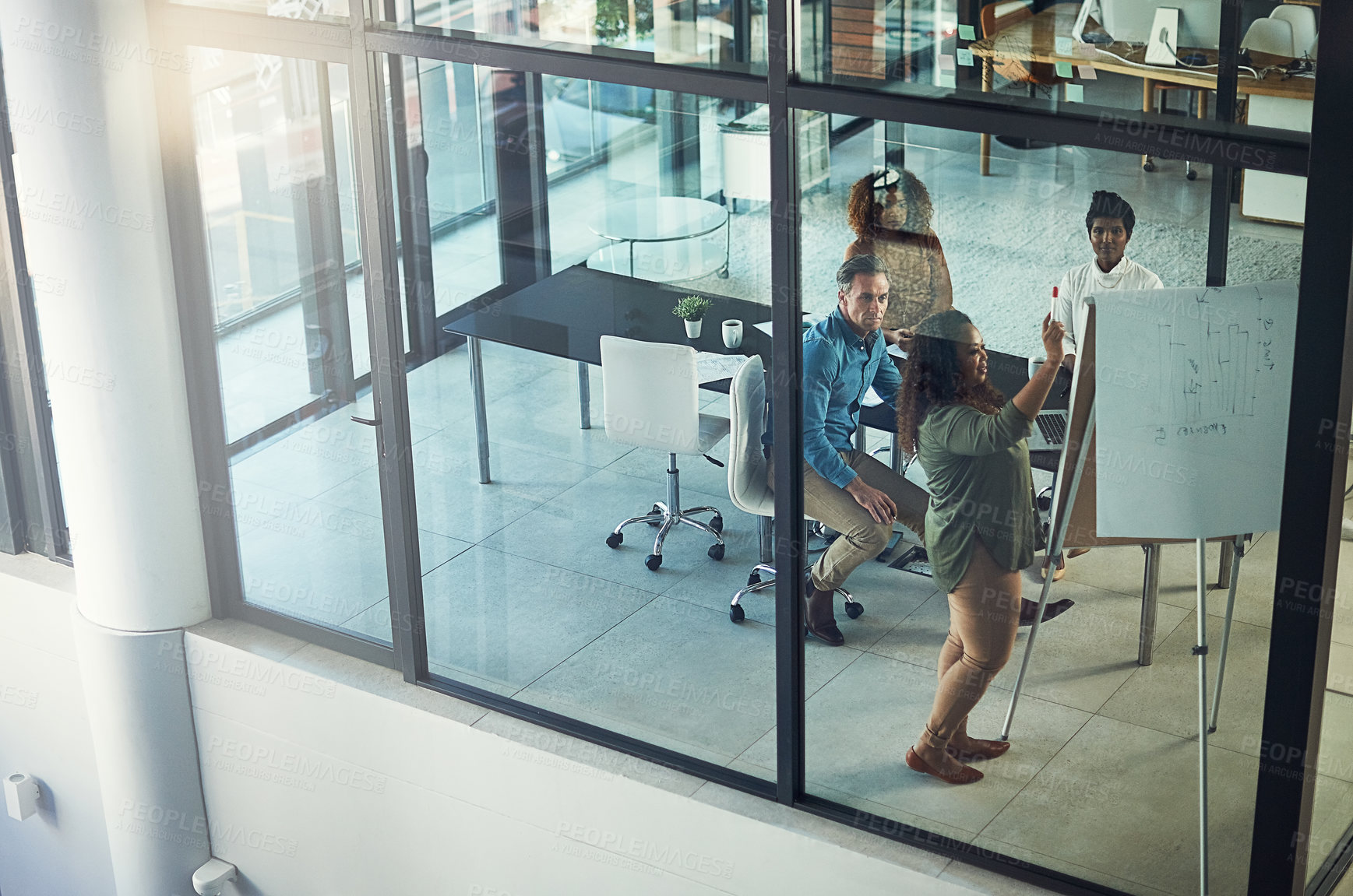 Buy stock photo High angle shot of a group of businesspeople having a meeting in a boardroom