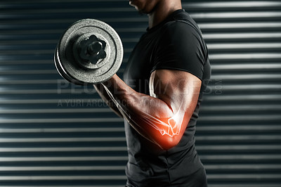 Buy stock photo Cropped shot of an unrecognizable man working out with dumbbells in the studio