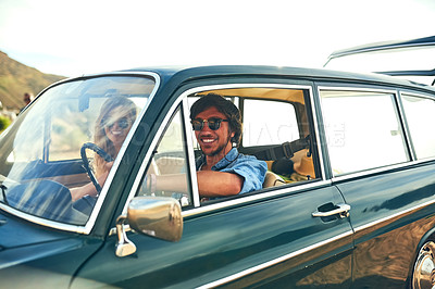 Buy stock photo Cropped portrait of an affectionate young couple taking a roadtrip together