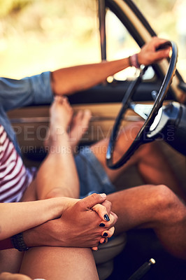 Buy stock photo Cropped shot of an affectionate young couple taking a roadtrip together