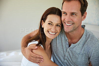 Buy stock photo Shot of a mature couple relaxing together in their bedroom