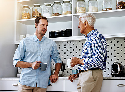 Buy stock photo Cropped shot of a man and his elderly father drinking coffee together at home