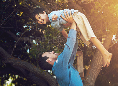Buy stock photo Portrait of a father and his young son spending quality time together outside