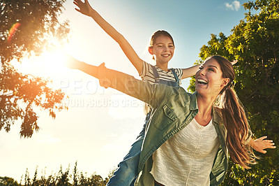 Buy stock photo Piggyback, flying and a mother and child in nature for bonding, happiness and love in summer. Laughing, smile and a mom and a girl kid in a park or garden for playing together and quality time