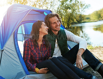 Buy stock photo Shot of an adventurous couple out camping together