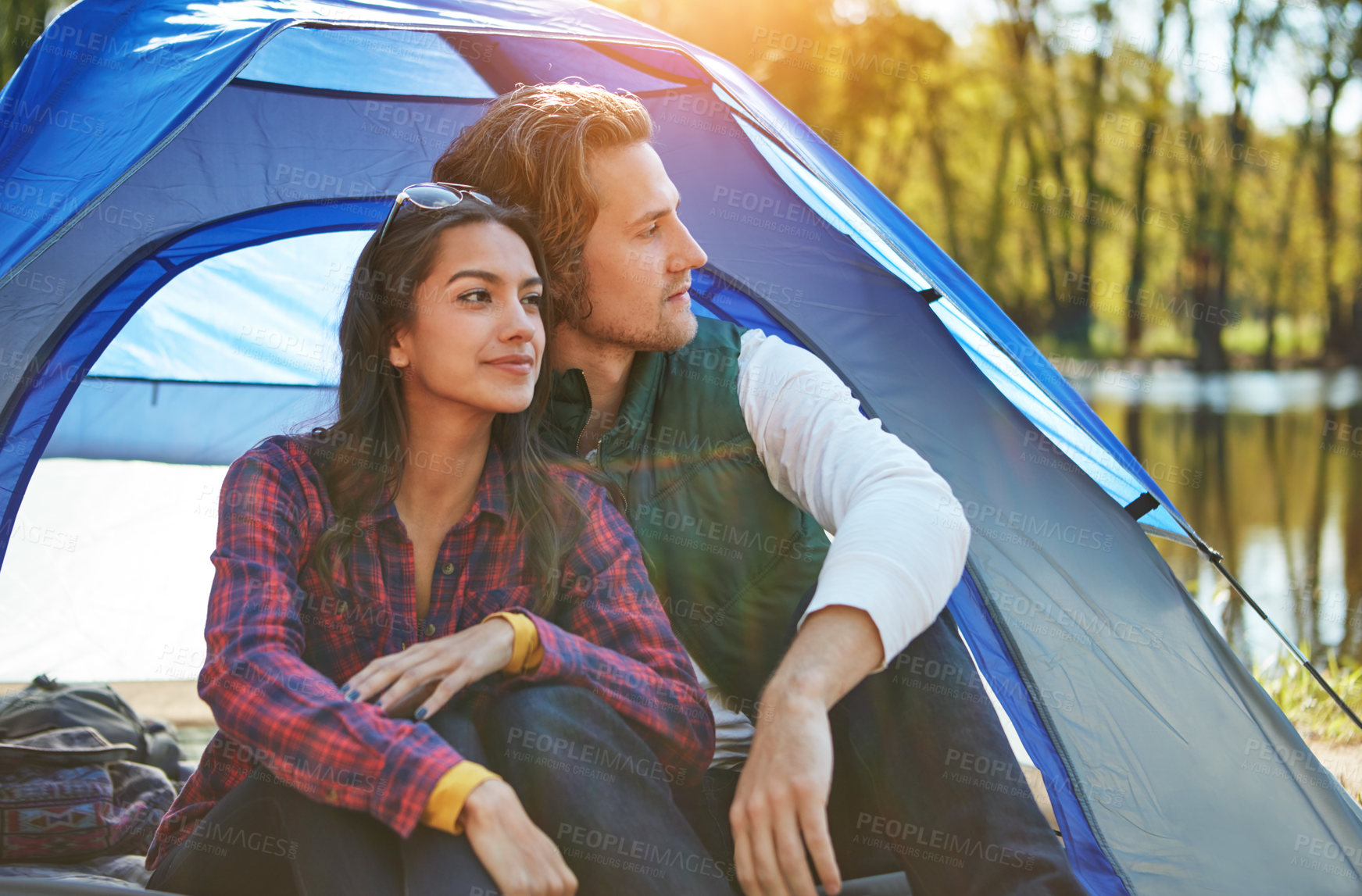 Buy stock photo Couple, thinking and camping outdoor to relax with love and happiness together on adventure in woods. People, smile or journey in nature with peace on holiday, vacation or travel in forest at river