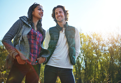 Buy stock photo Happy, young couple in park or nature together for holiday, vacation and romantic weekend break. Smiling, man and woman relax in forest or green environment for peace, freedom and summer travel