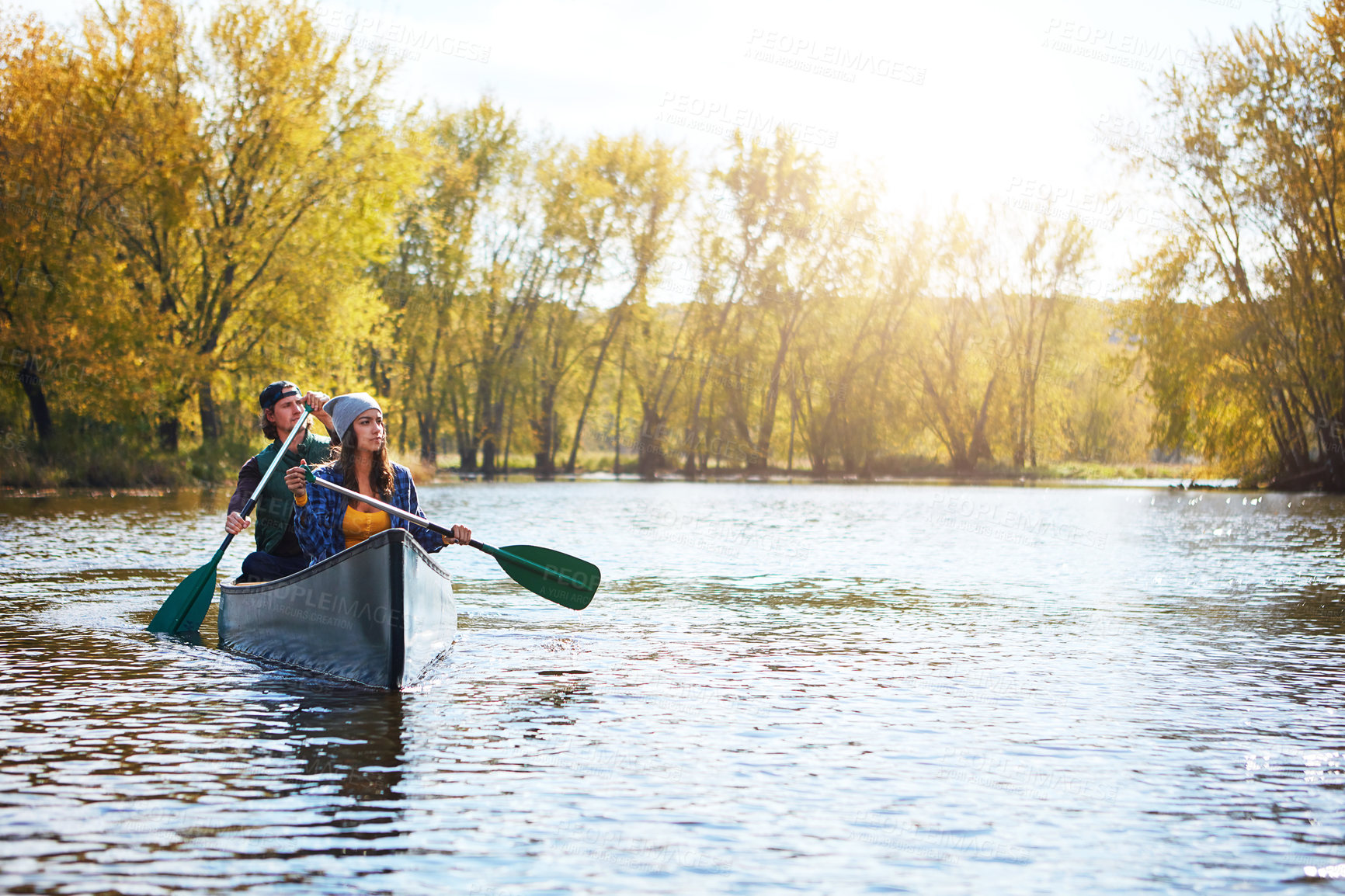 Buy stock photo Outdoor, kayaking and couple in boat on lake for vacation, bonding or getaway together with hobby. River, nature and people for rowing challenge with canoeing adventure on holiday or weekend trip.