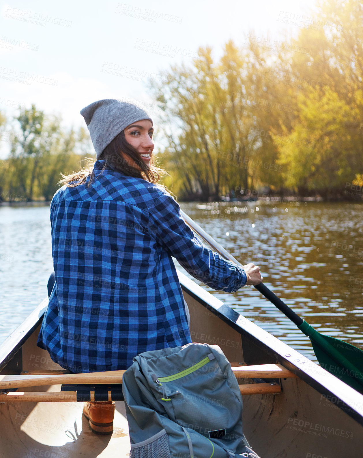 Buy stock photo Portrait of a young woman going for a canoe ride on the lake