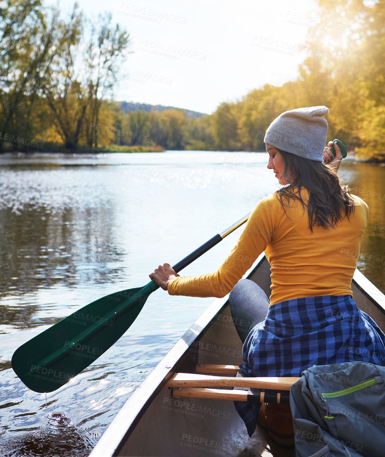 Buy stock photo Woman, back and canoeing in nature on water, wellness hobby and backpack for supplies with paddle for rowing. Vacation, relax and explore exercise on travel holiday, canoe boat and trees on river