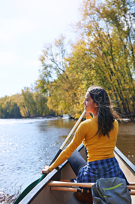 Buy stock photo Woman, happy and canoeing in nature on water, wellness hobby and backpack for supplies with paddle for rowing. Vacation, relax and explore exercise on travel holiday, canoe boat and trees on river