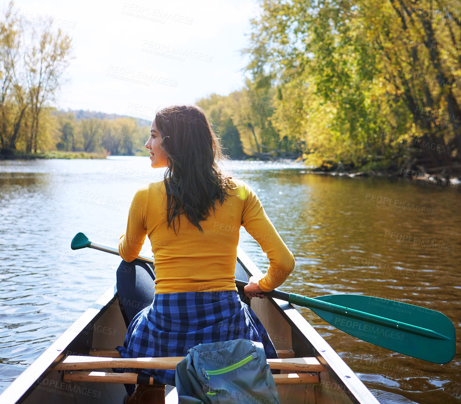 Buy stock photo Woman, back and canoeing for fitness on water, wellness hobby and backpack for supplies with paddle for rowing. Vacation, relax and explore exercise on travel holiday, canoe boat and trees on river